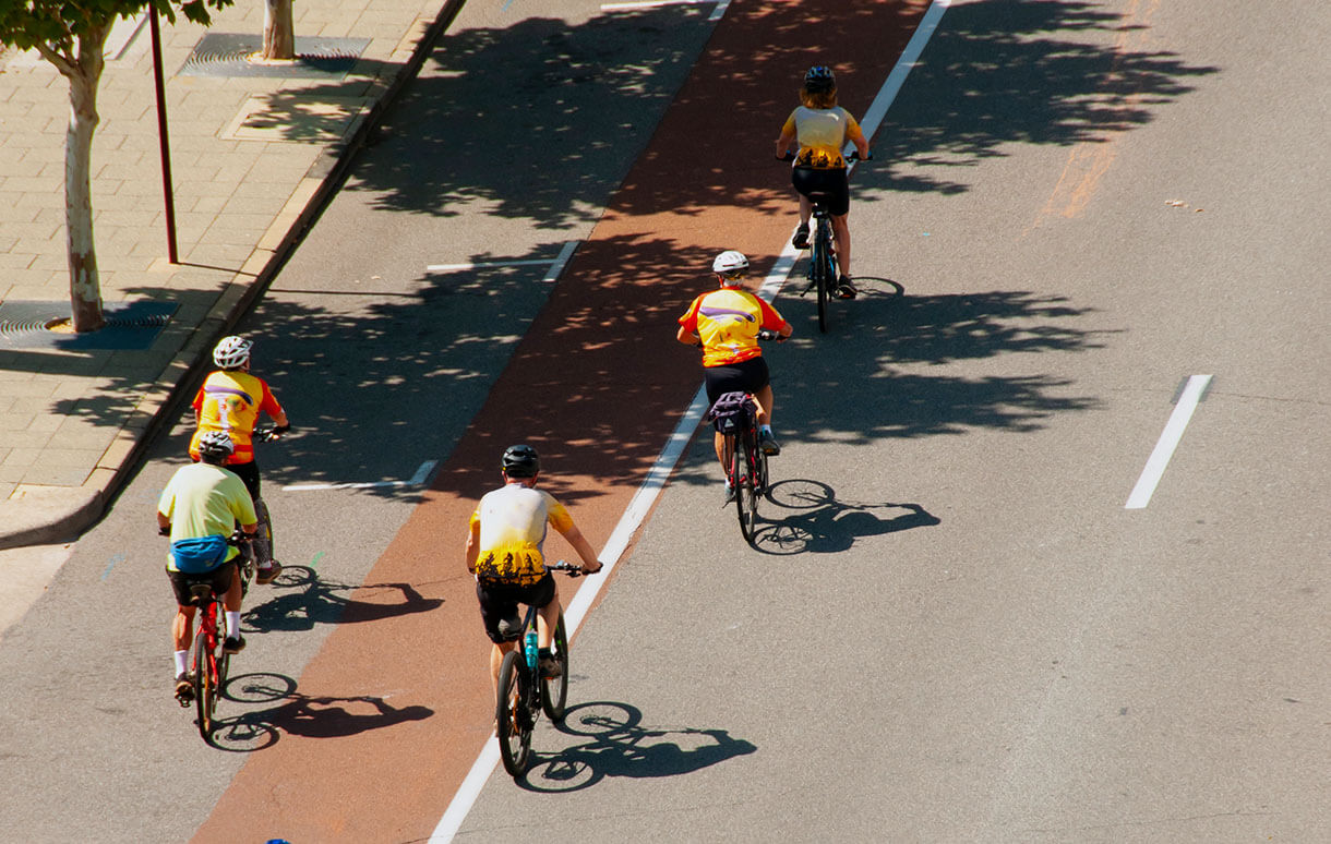 Five cyclists riding on road
